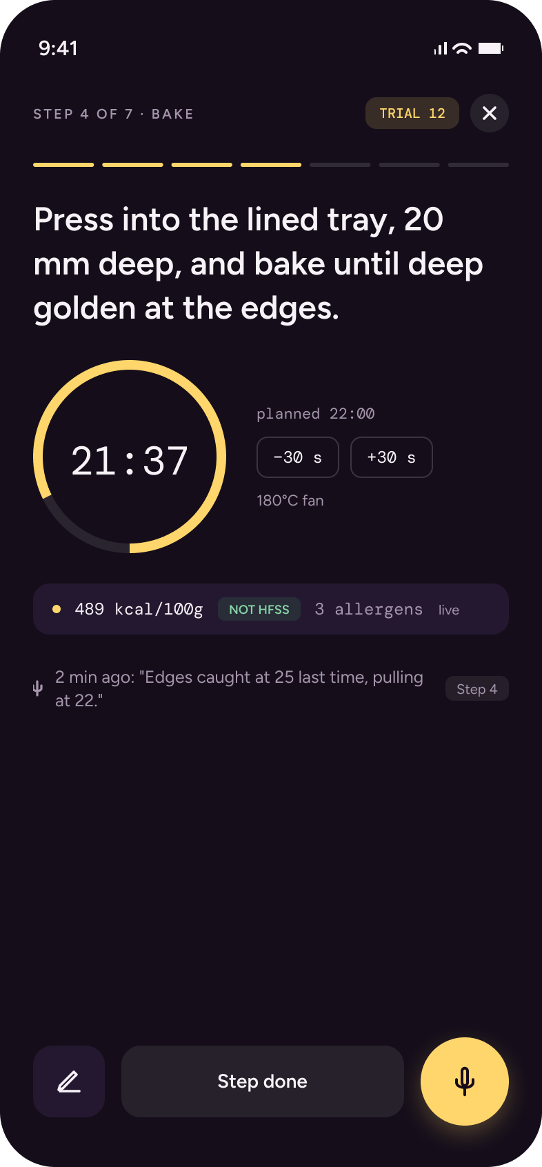 Bench step screen: a bake timer at 21:37, live figures reading 489 kcal per 100 g and NOT HFSS, and a voice capture button